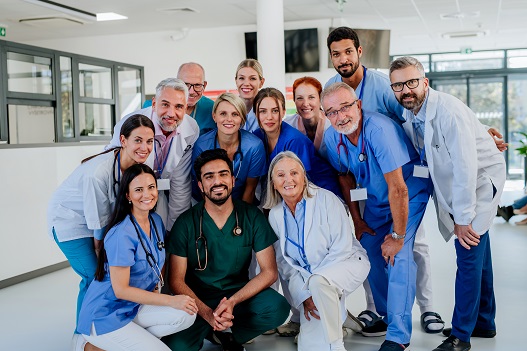 Happy doctors, nurses and medical professionals - Heart to Heart Hospice team